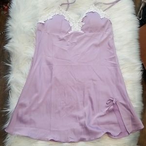 Satin gown delicate white lace against lilac satin.